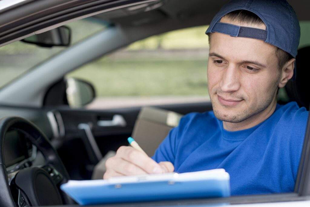 delivery man signing paper