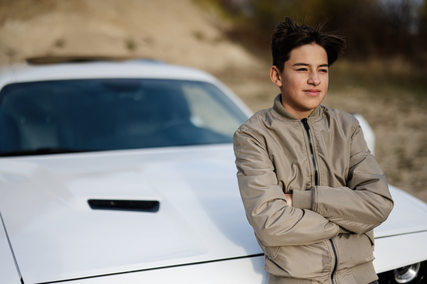 teenager boy stand near white muscle car young te 2023 11 27 05 27 13 utc Resized